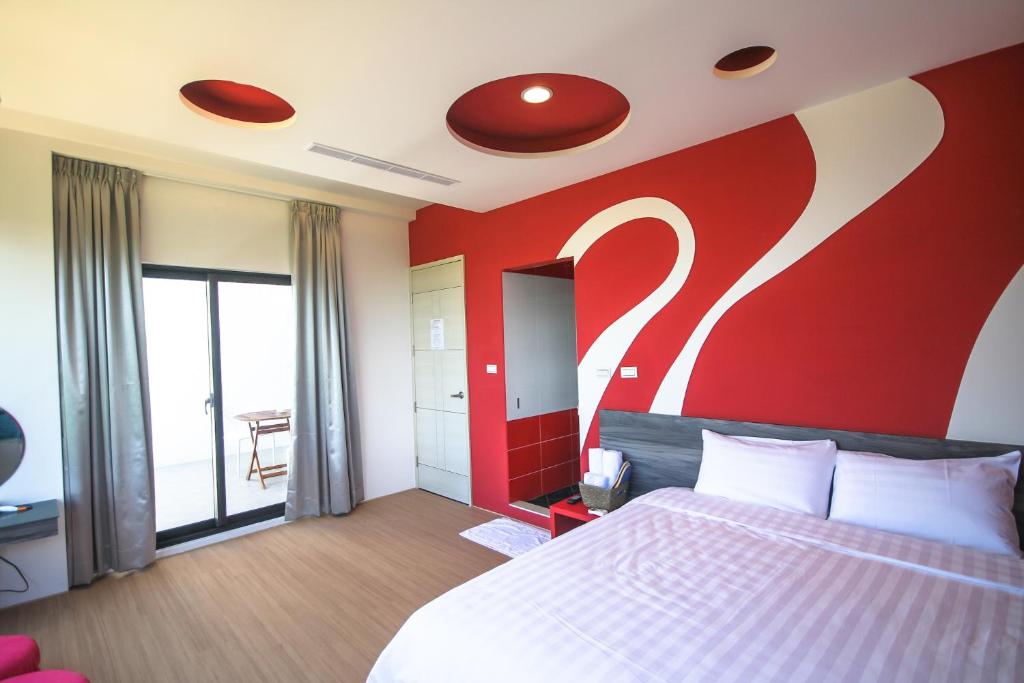 Postel nebo postele na pokoji v ubytování Colorful Homestay