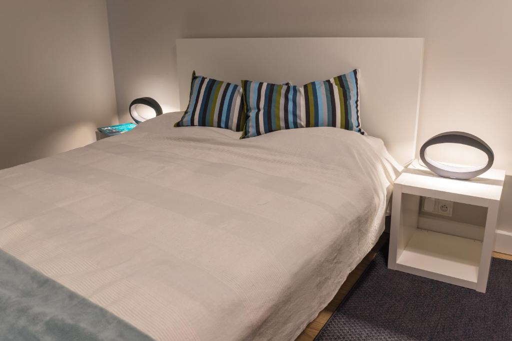Posteľ alebo postele v izbe v ubytovaní 3V Apartments