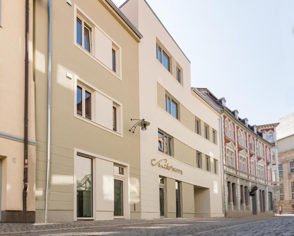 a building on a street in a city at Suites MITTE - Aparthotel in Eisenach