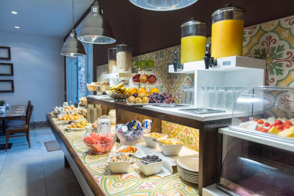 a buffet line with a lot of food on display at Palazzo Violetta in Sliema