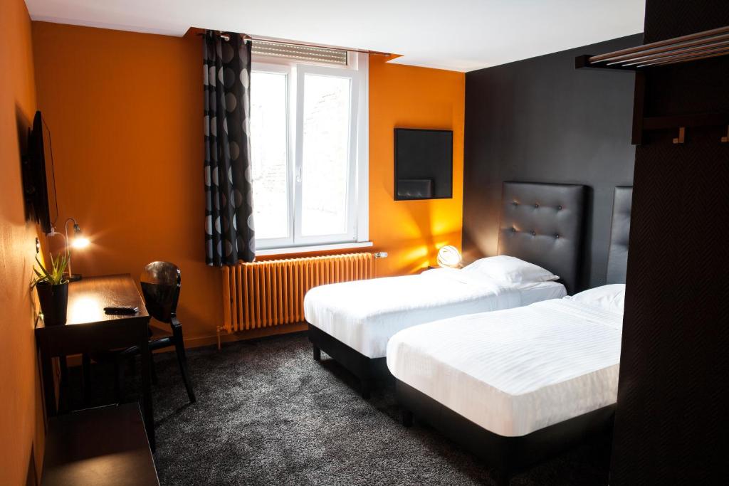 Postel nebo postele na pokoji v ubytování Cit'Hotel B Hotel Brasserie