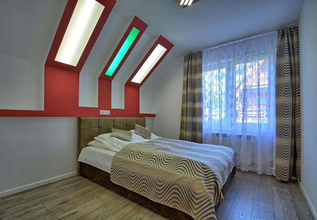 Postel nebo postele na pokoji v ubytování Jaworina- Apartamenty, Domki i Pokoje