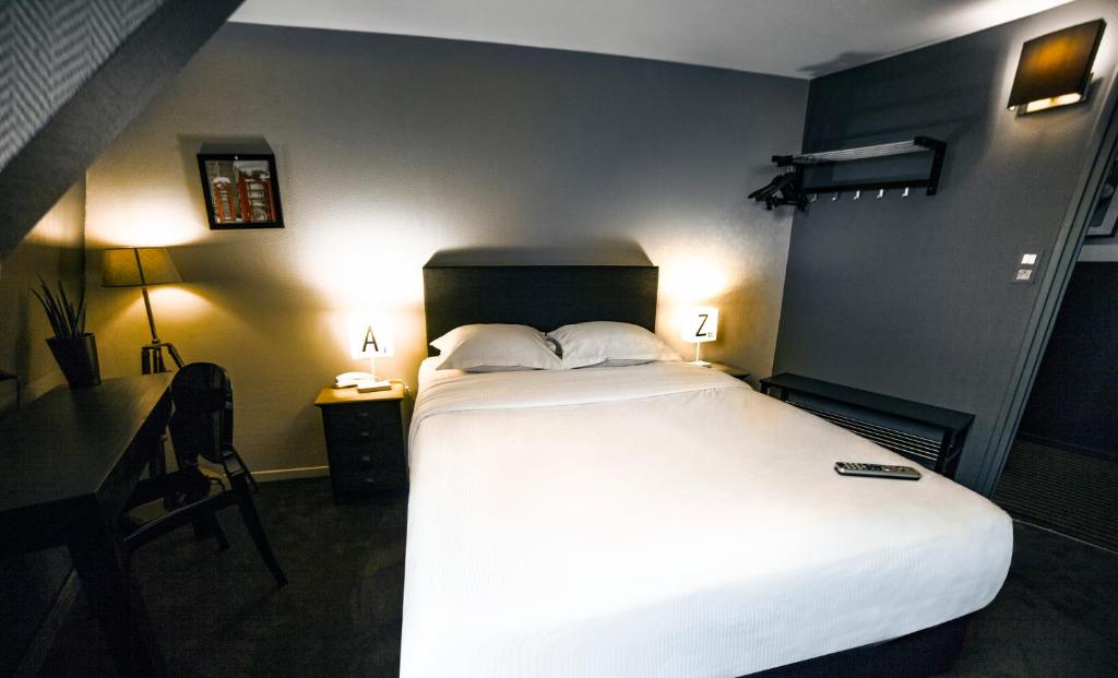 Postel nebo postele na pokoji v ubytování Cit'Hotel B Hotel Brasserie