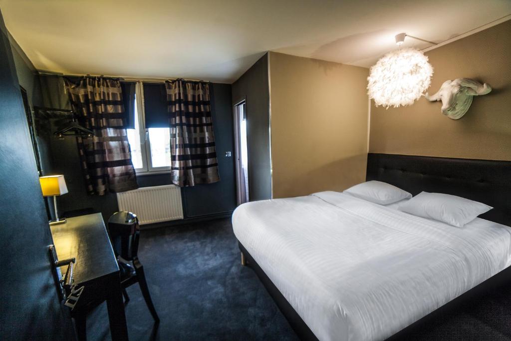 Postel nebo postele na pokoji v ubytování Cit'Hotel B Hotel Brasserie