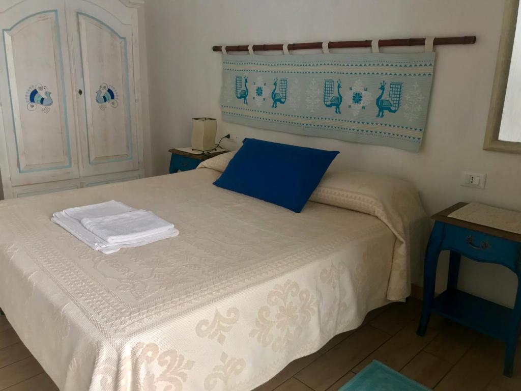 Postel nebo postele na pokoji v ubytování B&B Pascal House Nuoro_IUN E5016