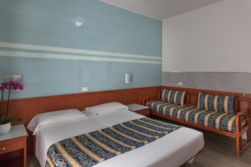 Postel nebo postele na pokoji v ubytování Hotel Colombo