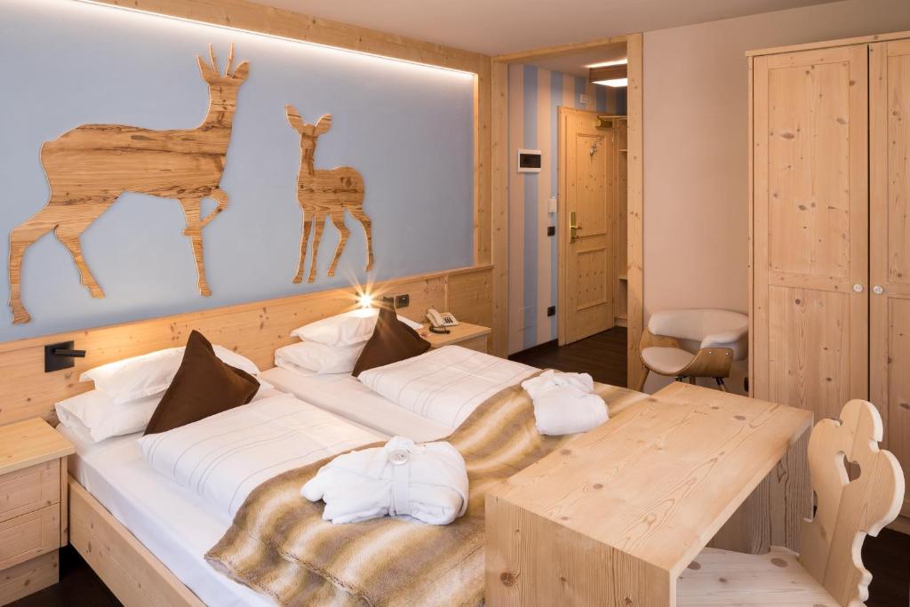 Postel nebo postele na pokoji v ubytování Hotel Somont