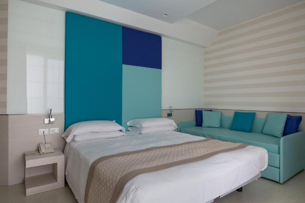 Postel nebo postele na pokoji v ubytování Hotel Colombo