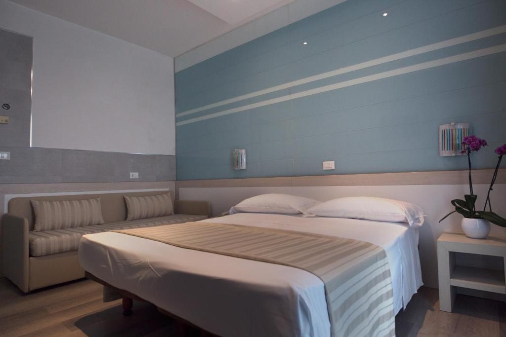 Postel nebo postele na pokoji v ubytování Hotel Colombo