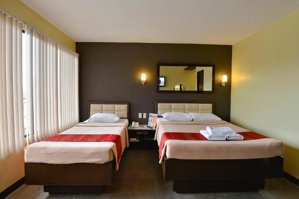 Postel nebo postele na pokoji v ubytování Express Inn Cebu Mabolo