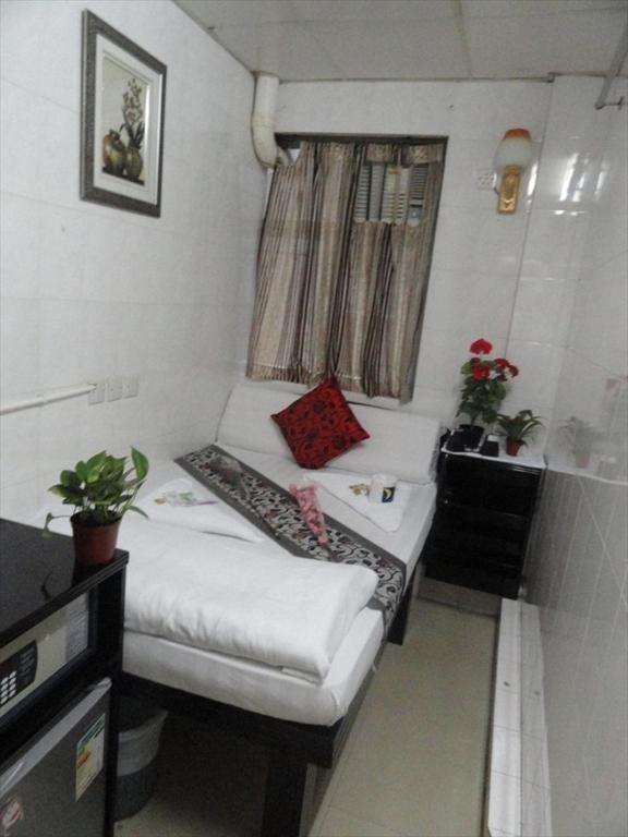 Postel nebo postele na pokoji v ubytování Paris Guest House