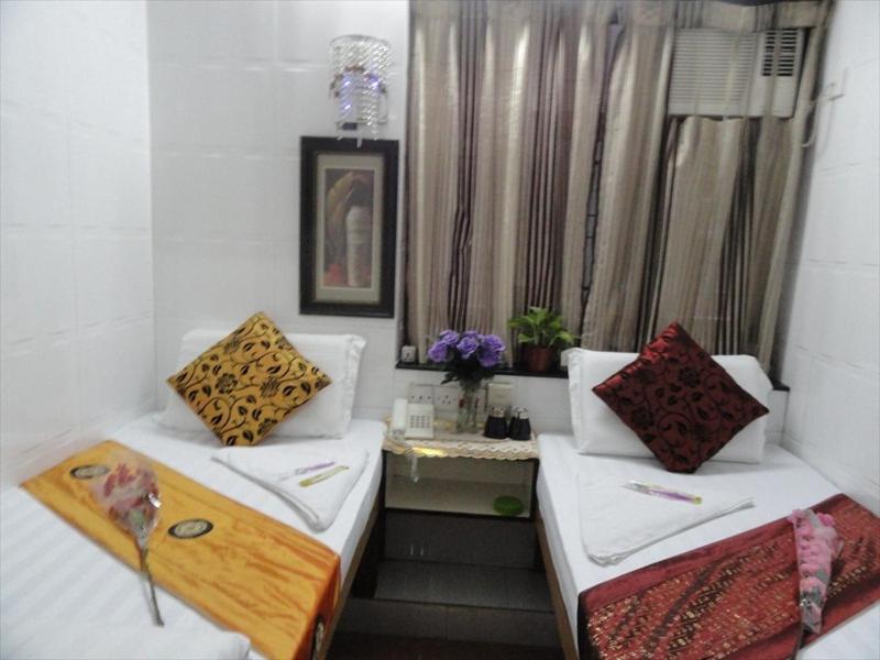 Postel nebo postele na pokoji v ubytování Paris Guest House