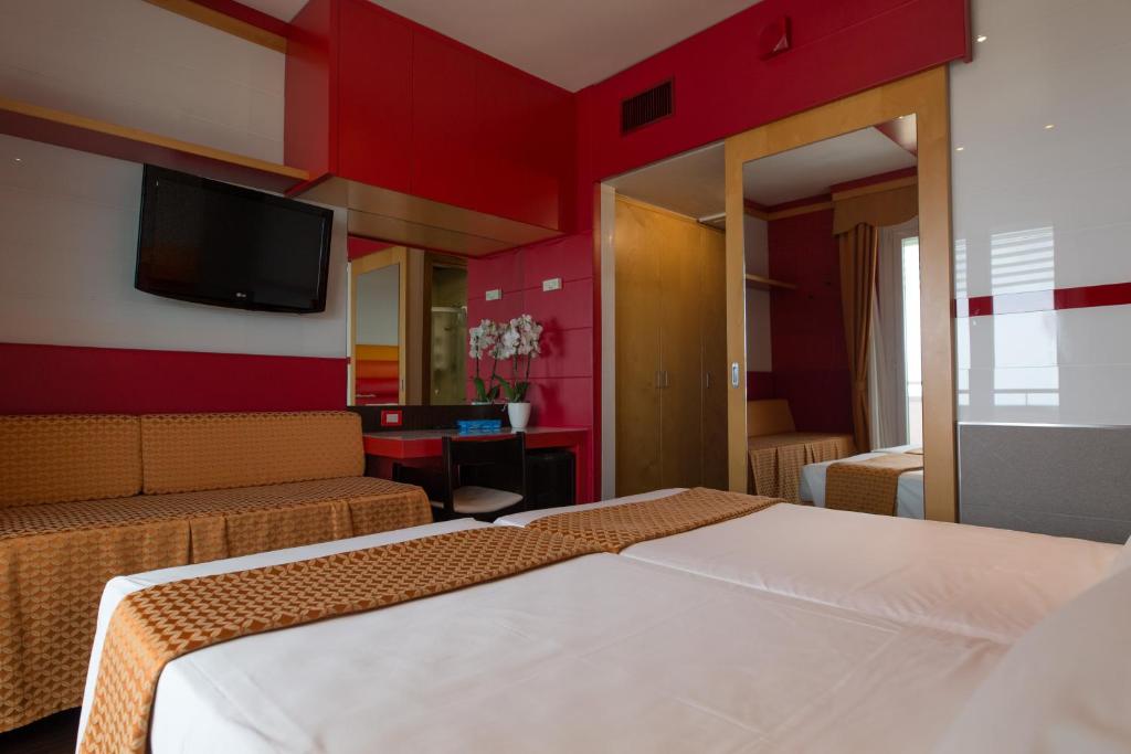 Postel nebo postele na pokoji v ubytování Hotel Cesare Augustus