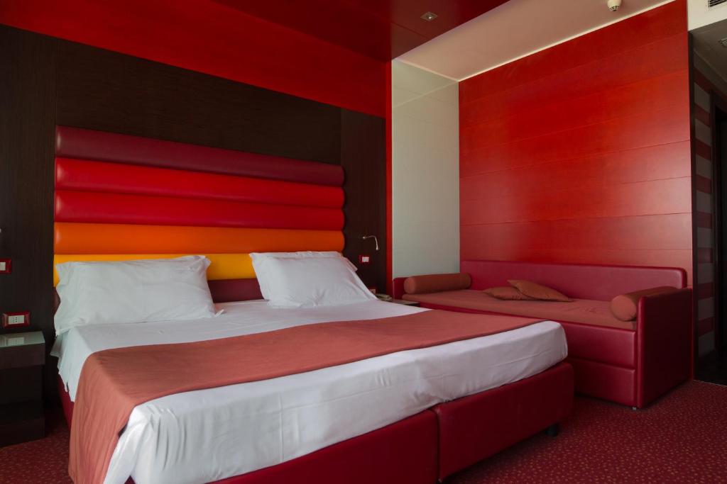 Postel nebo postele na pokoji v ubytování Hotel Cesare Augustus
