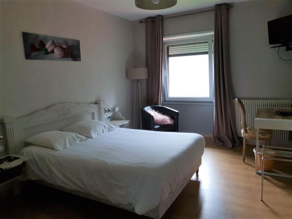 Postel nebo postele na pokoji v ubytování Hotel Du Donon