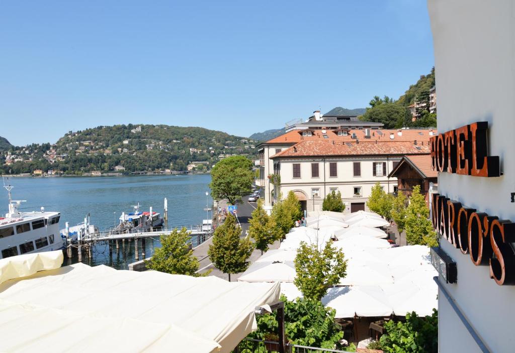 a view of a city with a river and buildings at Hotel Marco's in Como
