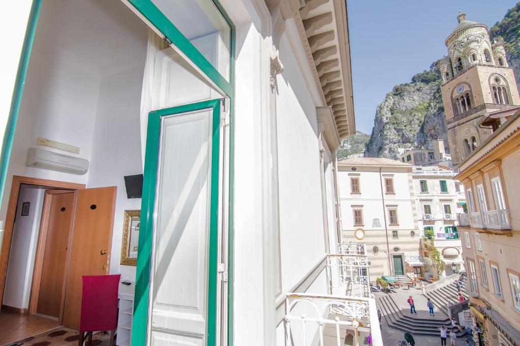 a balcony with a view of a city at Hotel Fontana in Amalfi