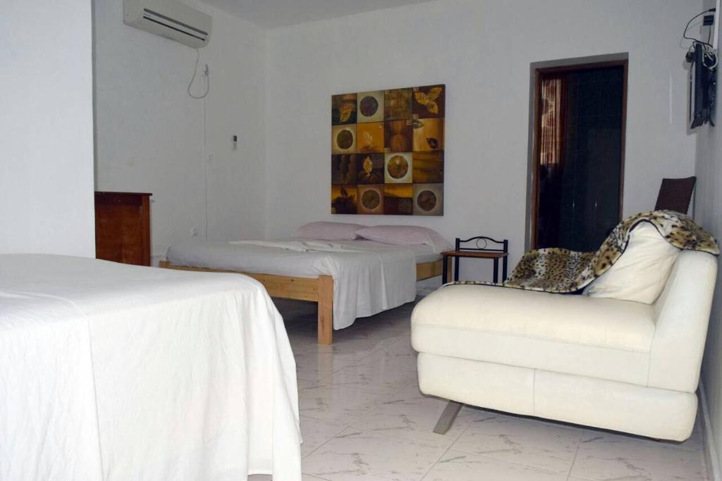 Postel nebo postele na pokoji v ubytování Hotel Miramar Fogo Brava
