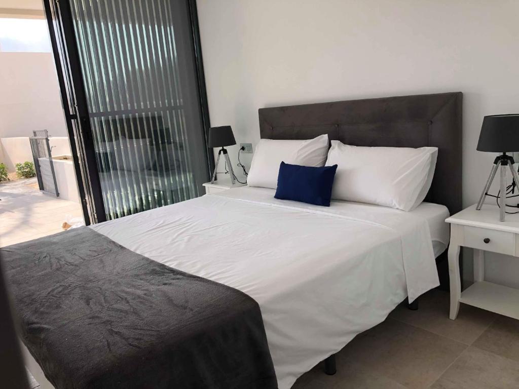 A bed or beds in a room at Dimalbirpark Ground Floor A
