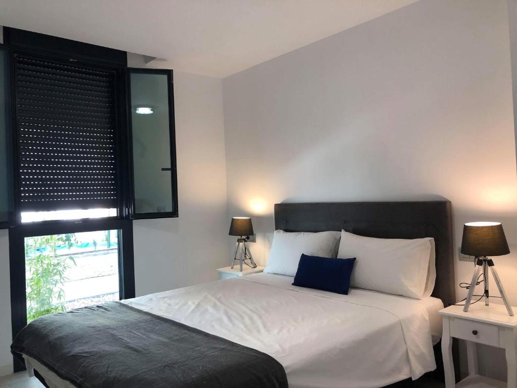 A bed or beds in a room at Dimalbirpark Ground Floor A