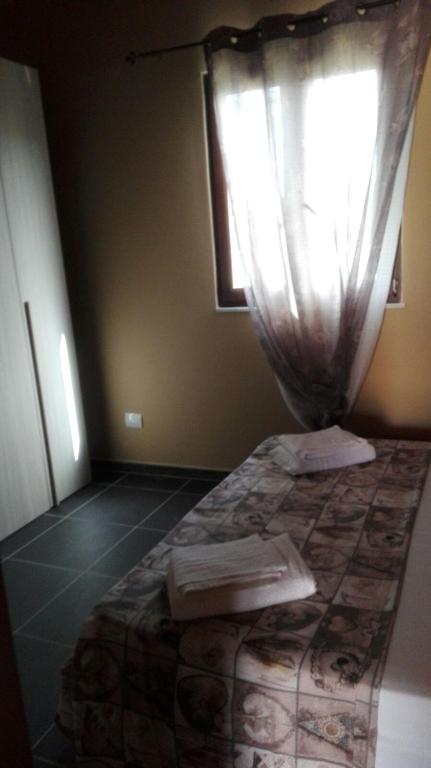 Łóżko lub łóżka w pokoju w obiekcie Villa la Perla