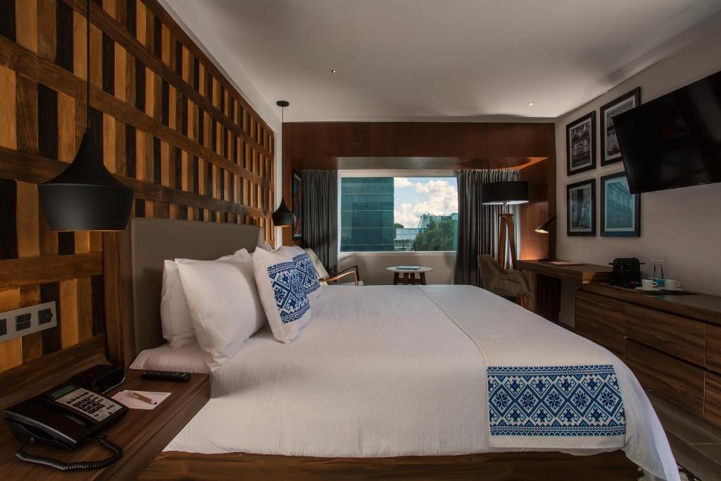 Postel nebo postele na pokoji v ubytování Hotel Indigo Guadalajara Expo by IHG
