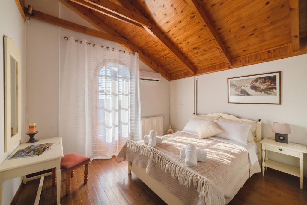 Postel nebo postele na pokoji v ubytování Villa Elea