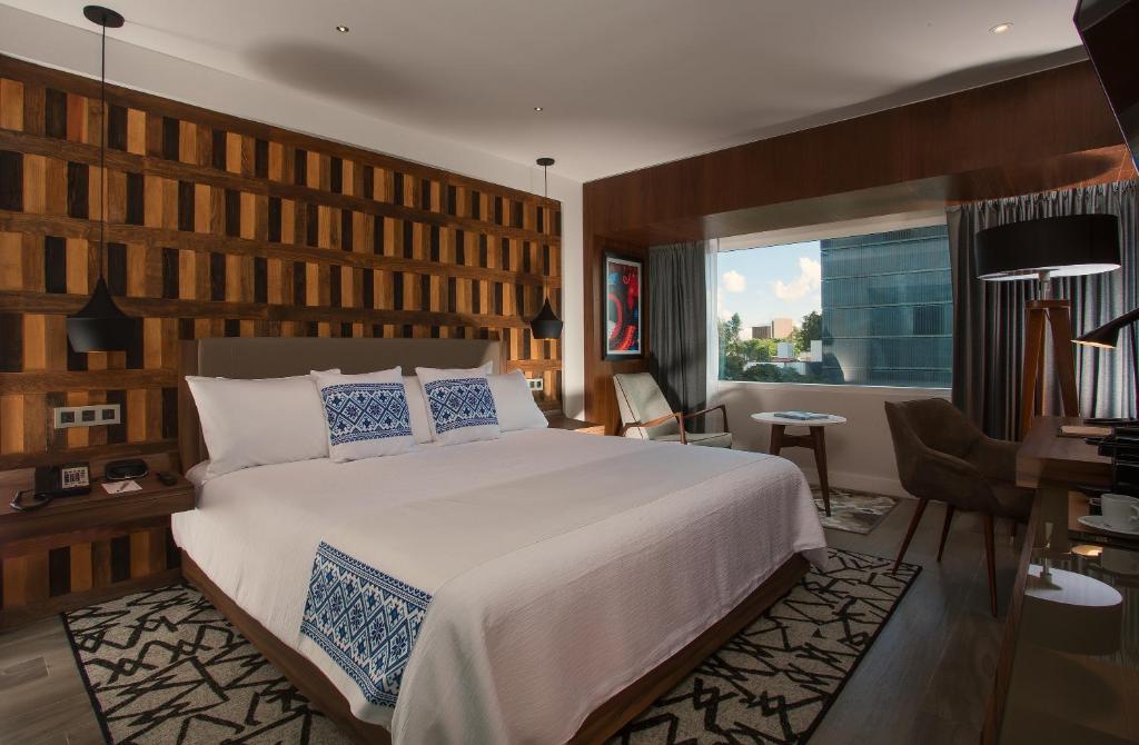 Postel nebo postele na pokoji v ubytování Hotel Indigo Guadalajara Expo by IHG