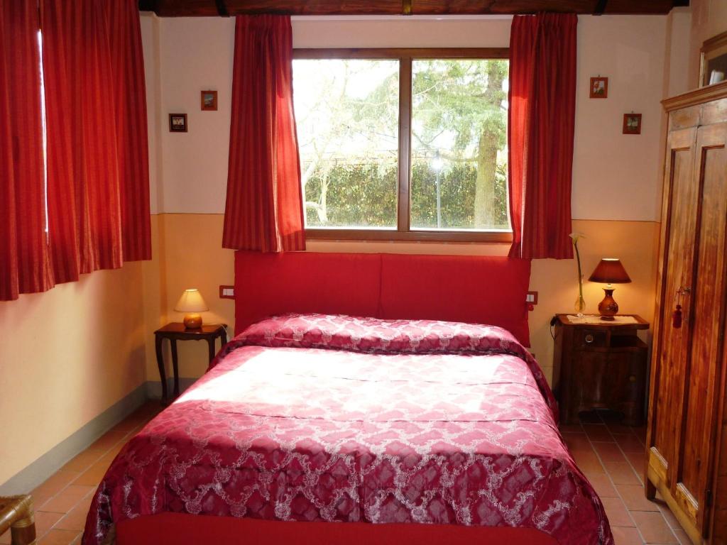 Postel nebo postele na pokoji v ubytování B&B Casale Ginette
