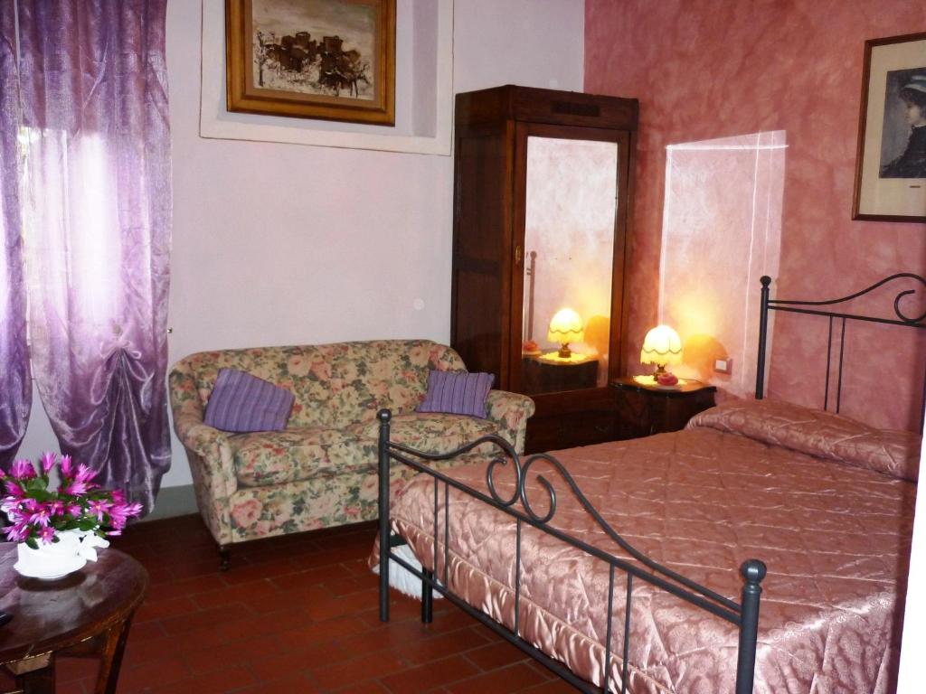 Postel nebo postele na pokoji v ubytování B&B Casale Ginette