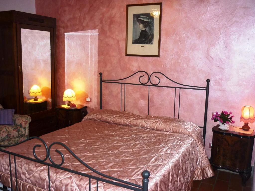 Postel nebo postele na pokoji v ubytování B&B Casale Ginette