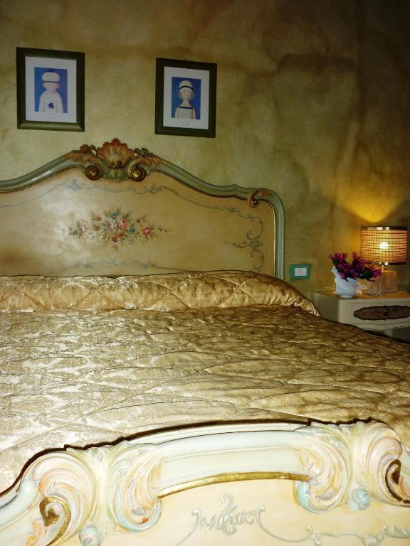 Postel nebo postele na pokoji v ubytování B&B Casale Ginette