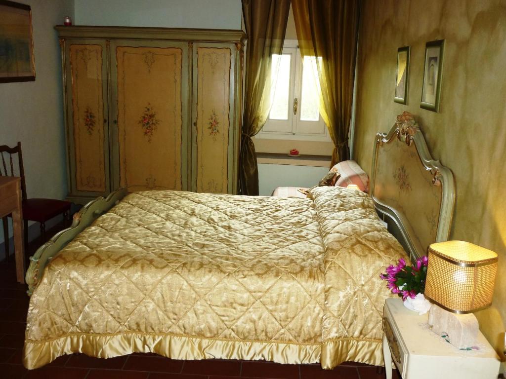 Postel nebo postele na pokoji v ubytování B&B Casale Ginette