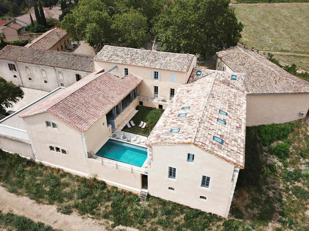 an aerial view of a house with a swimming pool at Chartreuse de Mougeres - Pézenas in Caux