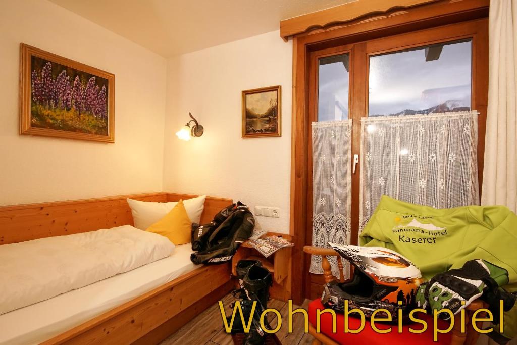 Postel nebo postele na pokoji v ubytování Panorama Hotel Kaserer