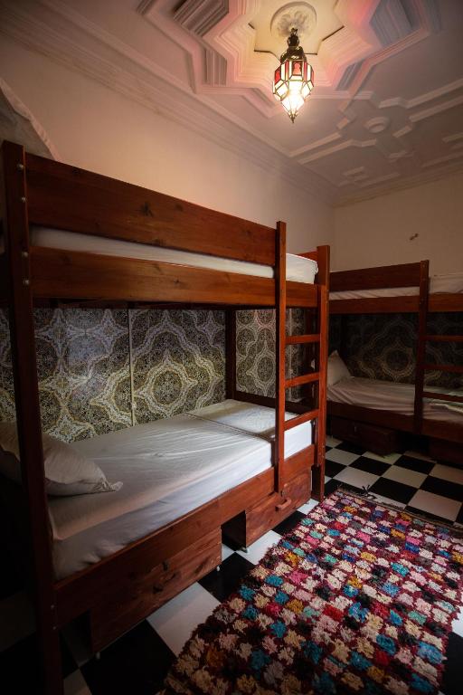 Postel nebo postele na pokoji v ubytování Mosaic Hostel