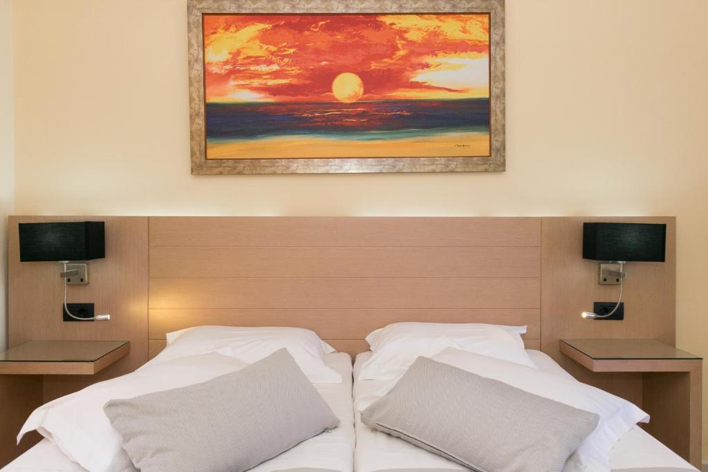 Postel nebo postele na pokoji v ubytování Aetheras Beach