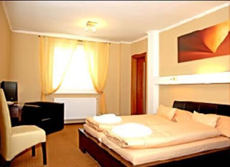 Postel nebo postele na pokoji v ubytování Hotel Galileo