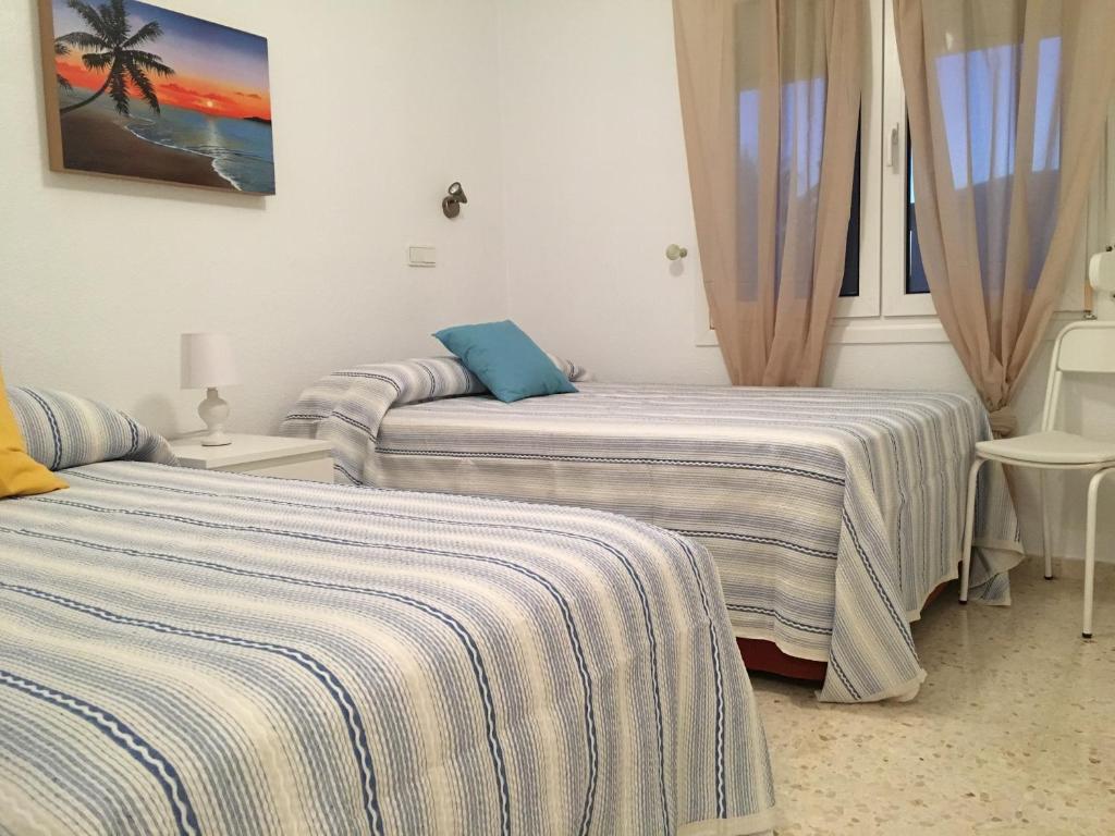 Postel nebo postele na pokoji v ubytování Frente al Mar - Rosales