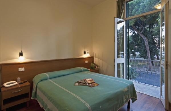 Postel nebo postele na pokoji v ubytování Hotel Firenze