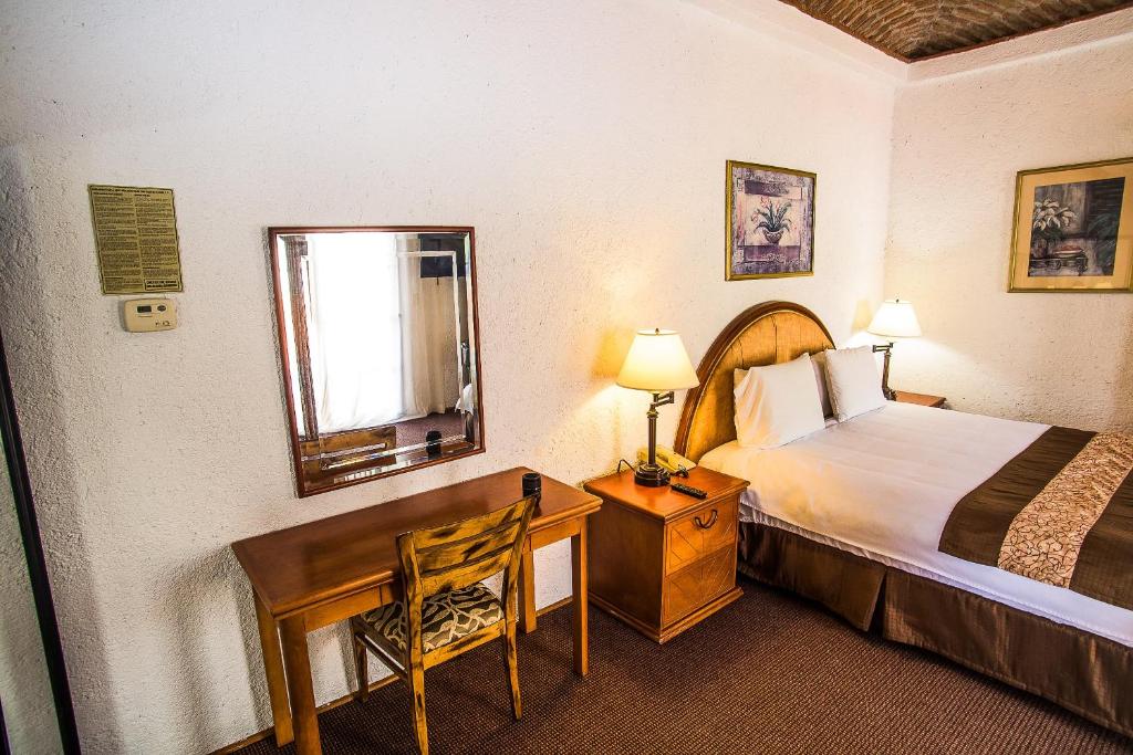 Postel nebo postele na pokoji v ubytování Real del Mar Golf Resort