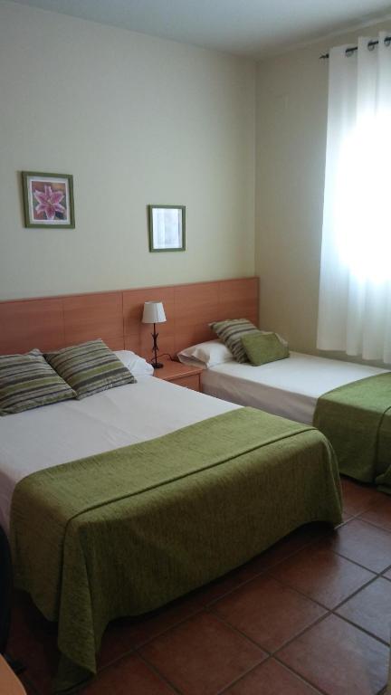 Postel nebo postele na pokoji v ubytování Hostal Sant Roc