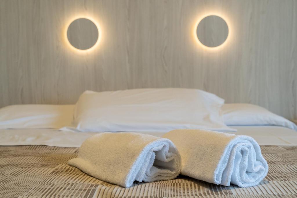 Łóżko lub łóżka w pokoju w obiekcie Hotel Continental