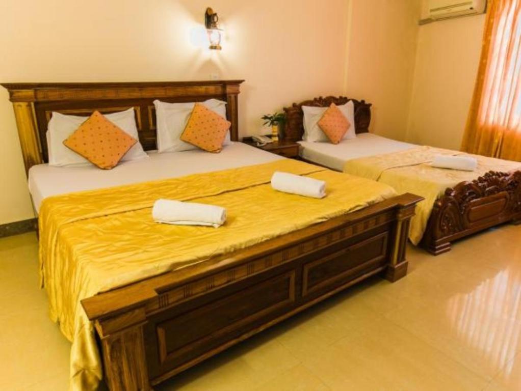 Postel nebo postele na pokoji v ubytování Asia Hotel