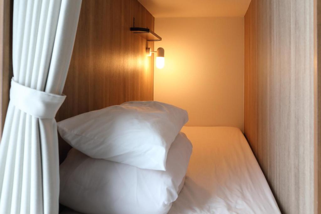 Postel nebo postele na pokoji v ubytování Hostel Kura
