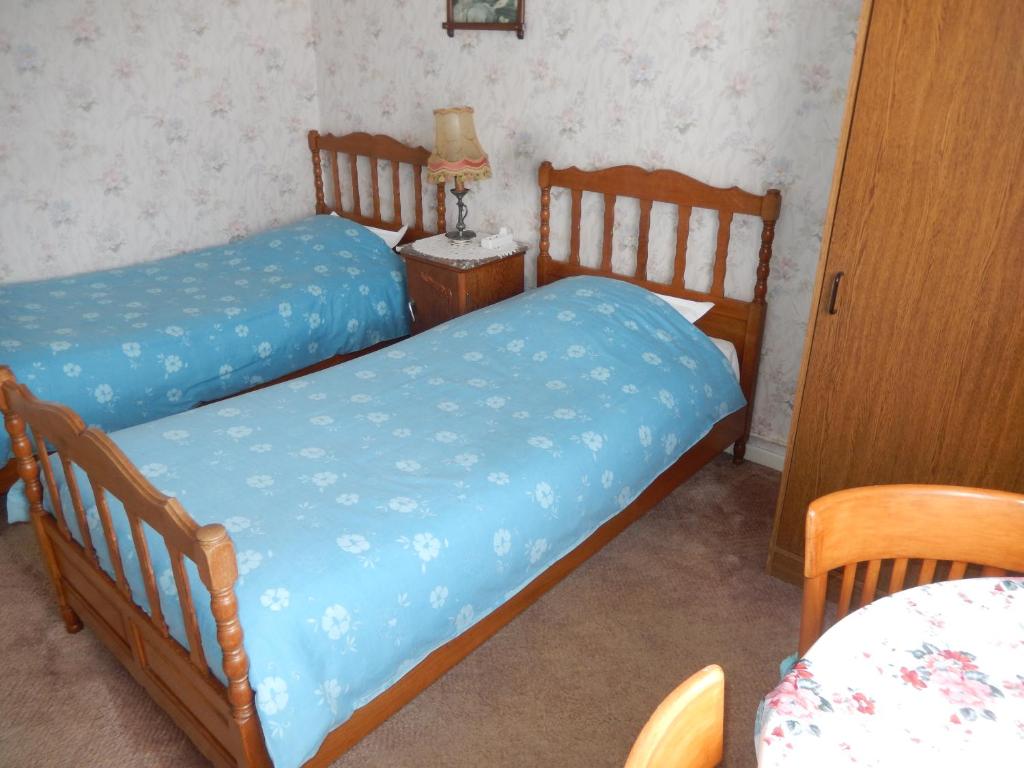 Postel nebo postele na pokoji v ubytování Au logis fleuri