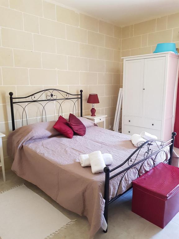 Postel nebo postele na pokoji v ubytování Palm Court Apartment
