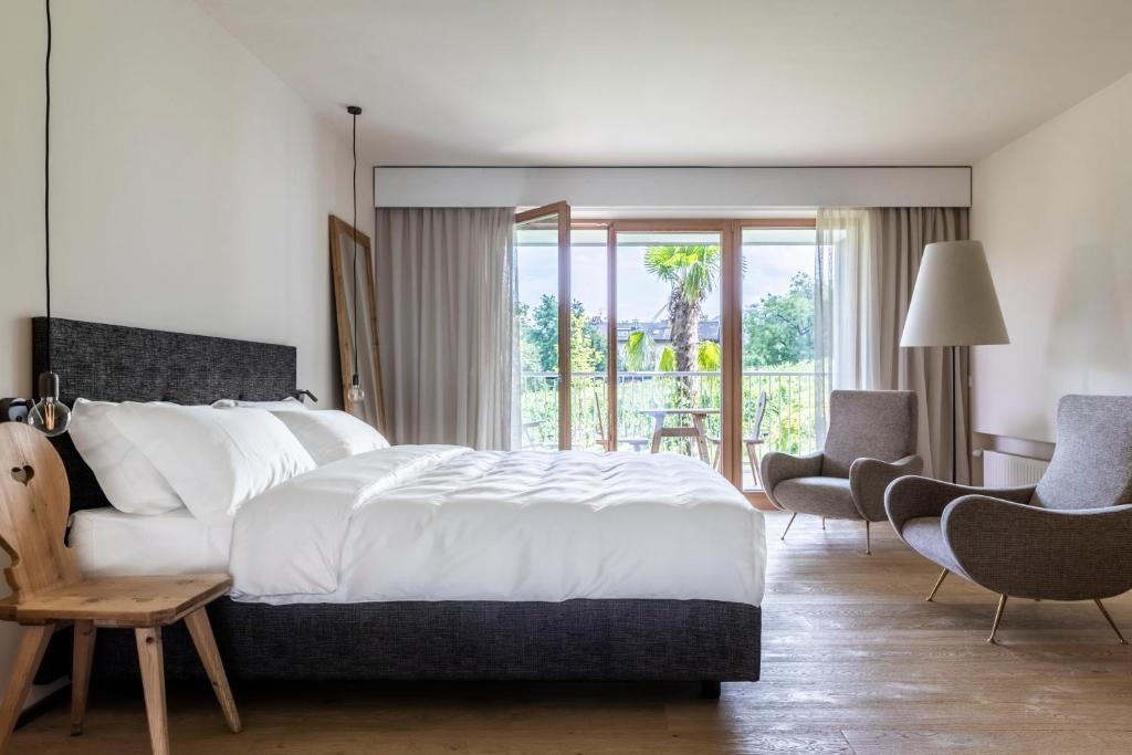 Postel nebo postele na pokoji v ubytování Boutique-Hotel Ballguthof am Golfplatz