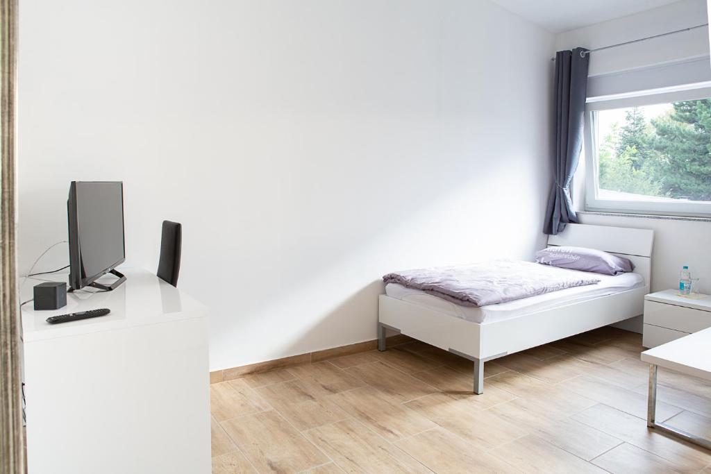 Postel nebo postele na pokoji v ubytování Holidayapartment Rüsselsheim