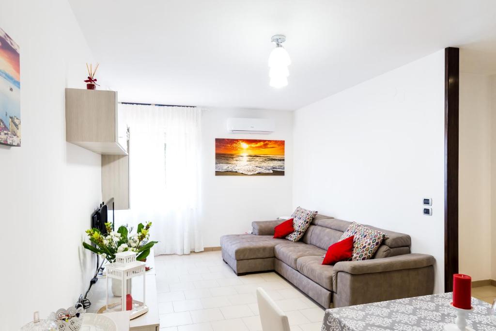 a living room with a couch and a table at Flai Home in Vico Equense